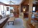 Comfortable living room featuring carpet, wood paneled walls, and views to other rooms at 2604 Palmetto Blvd, Edisto Island, SC 29438