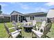 This fenced backyard features an outdoor fire pit with six Adirondack chairs at 2809 Conservancy Ln, Charleston, SC 29414