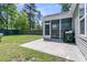 An enclosed screened porch with an outdoor grill overlooks the beautiful fenced backyard at 2809 Conservancy Ln, Charleston, SC 29414