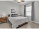 This bright bedroom features a queen-size bed with wood floors and a modern nightstand at 2809 Conservancy Ln, Charleston, SC 29414