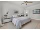 Serene bedroom features soft gray bedding, stylish nightstands, and neutral decor for a calming retreat at 2809 Conservancy Ln, Charleston, SC 29414
