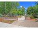 The brick-paved community entrance at Carolina Bay Park features lush landscaping and walking paths at 2809 Conservancy Ln, Charleston, SC 29414