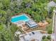 An aerial view shows the community pool, playground, and parking nestled in the trees at 2809 Conservancy Ln, Charleston, SC 29414