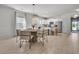 Open-concept kitchen and dining area with white cabinetry and modern stainless appliances at 2809 Conservancy Ln, Charleston, SC 29414