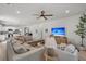 Open-concept living area showcases a comfortable sectional sofa, modern decor, and a seamless flow to the kitchen at 2809 Conservancy Ln, Charleston, SC 29414
