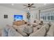 Spacious living room featuring modern decor, a large sectional sofa, and a ceiling fan at 2809 Conservancy Ln, Charleston, SC 29414