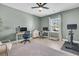 Bright office with two desks, modern chairs, a Peloton bike, and luxury vinyl floors at 2809 Conservancy Ln, Charleston, SC 29414