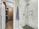 Bathroom featuring a glass shower with white marble tile and a view of a well-organized closet space at 2827 Wagner Way, Mount Pleasant, SC 29466