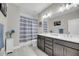 Bathroom featuring double vanity, gray cabinetry, and stylish shower curtain at 2827 Wagner Way, Mount Pleasant, SC 29466