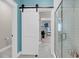 Bathroom featuring an open sliding barn door that reveals an adjacent room, as well as a glass shower at 2827 Wagner Way, Mount Pleasant, SC 29466