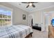 Bright bedroom featuring a plush bed, large windows, and easy access to an ensuite bathroom at 2827 Wagner Way, Mount Pleasant, SC 29466