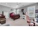 Bright bedroom boasts neutral walls, ceiling fan, and large windows letting in natural light at 2827 Wagner Way, Mount Pleasant, SC 29466