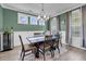 Dining room showcasing a dining table, chairs, a modern chandelier, and a wine refrigerator at 2827 Wagner Way, Mount Pleasant, SC 29466