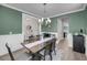 Elegant dining room with wainscoting, designer lighting, and a decorative table arrangement at 2827 Wagner Way, Mount Pleasant, SC 29466
