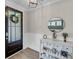 Bright entryway featuring a wood door, console table with decor, and wood-look flooring at 2827 Wagner Way, Mount Pleasant, SC 29466