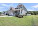 Lovely two-story home boasting a well-manicured lawn, a covered front porch, and an attached two-car garage at 2827 Wagner Way, Mount Pleasant, SC 29466