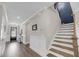 Inviting home foyer features wood floors, a staircase, and stylish wainscoting for added charm and character at 2827 Wagner Way, Mount Pleasant, SC 29466