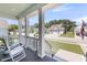 Inviting front porch with rocking chairs and views of a quiet neighborhood street at 2827 Wagner Way, Mount Pleasant, SC 29466