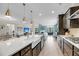 Spacious open-concept kitchen flowing into the living room and dining area at 2827 Wagner Way, Mount Pleasant, SC 29466