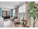 Bright living room with decorative chairs, large windows, and natural light at 2827 Wagner Way, Mount Pleasant, SC 29466