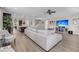 Open-concept living room with large sectional sofa, ceiling fan, and modern entertainment center at 2827 Wagner Way, Mount Pleasant, SC 29466