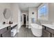 Luxurious main bathroom with freestanding tub and vanity with dual sinks at 2827 Wagner Way, Mount Pleasant, SC 29466