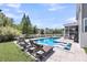 Backyard view of a sparkling pool with lounge chairs on a large patio at 2827 Wagner Way, Mount Pleasant, SC 29466