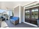 Inviting porch with cozy seating, featuring wicker furniture with blue cushions, and double door entry at 2827 Wagner Way, Mount Pleasant, SC 29466