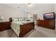 Inviting bedroom with a wooden bed frame, a dresser, and carpeted flooring at 314 Beverly Dr, Ladson, SC 29456