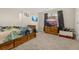 Cozy bedroom with soft carpet, a comfortable bed, and a large TV screen at 314 Beverly Dr, Ladson, SC 29456