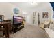 Cozy bonus room with comfortable seating, TV, and decorative wall hangings at 314 Beverly Dr, Ladson, SC 29456