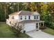 Inviting two-story home with a covered front porch and well-manicured landscaping at 314 Beverly Dr, Ladson, SC 29456