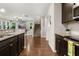 Open kitchen design with granite countertops, hardwood floors, and stainless steel appliances at 314 Beverly Dr, Ladson, SC 29456