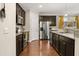 Updated kitchen featuring stainless steel appliances, granite countertops, and dark cabinetry at 314 Beverly Dr, Ladson, SC 29456