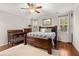 Main bedroom featuring a wooden bed frame, wood floors, ceiling fan, and natural light at 314 Beverly Dr, Ladson, SC 29456