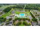 Aerial view of the community pool, body of water, and other nearby buildings at 317 Pimpernel St, Summerville, SC 29483