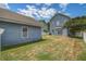 View of the backyard featuring a grassy lawn, siding, and a wooden fence at 317 Pimpernel St, Summerville, SC 29483