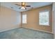 Spacious bedroom with natural light, carpet, a ceiling fan, and views of outside at 317 Pimpernel St, Summerville, SC 29483