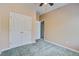 This bedroom features a ceiling fan, plush carpet, and a double door closet at 317 Pimpernel St, Summerville, SC 29483