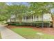 View of the White Gables Club building surrounded by lush landscaping at 317 Pimpernel St, Summerville, SC 29483