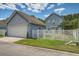 View of the blue home featuring an attached garage and freshly cut grass at 317 Pimpernel St, Summerville, SC 29483