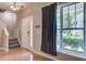 Bright foyer with hardwood floors, staircase, and a large window with curtains at 317 Pimpernel St, Summerville, SC 29483