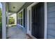 Inviting front porch with decorative columns, well-maintained landscaping, and a front door with sidelight at 317 Pimpernel St, Summerville, SC 29483