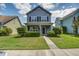 Charming two-story home with a well-manicured lawn and inviting front porch in a suburban neighborhood at 317 Pimpernel St, Summerville, SC 29483