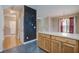 Transitional kitchen with an island bar adjacent to living area, with wood and vinyl flooring at 317 Pimpernel St, Summerville, SC 29483