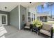 Cozy back porch features comfortable seating with views of the backyard at 3191 Moonlight Dr, Charleston, SC 29414