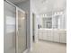 Bright bathroom featuring double sink vanity, a glass-door shower, and tile flooring at 3191 Moonlight Dr, Charleston, SC 29414