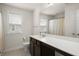 Bathroom featuring a dark wood vanity and a large well lit mirror at 3191 Moonlight Dr, Charleston, SC 29414