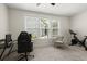 Bedroom offers natural light, a ceiling fan, and views of the backyard, perfect for relaxing and working at 3191 Moonlight Dr, Charleston, SC 29414
