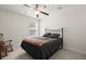 Bedroom with a black metal bed frame and a traditional ceiling fan at 3191 Moonlight Dr, Charleston, SC 29414